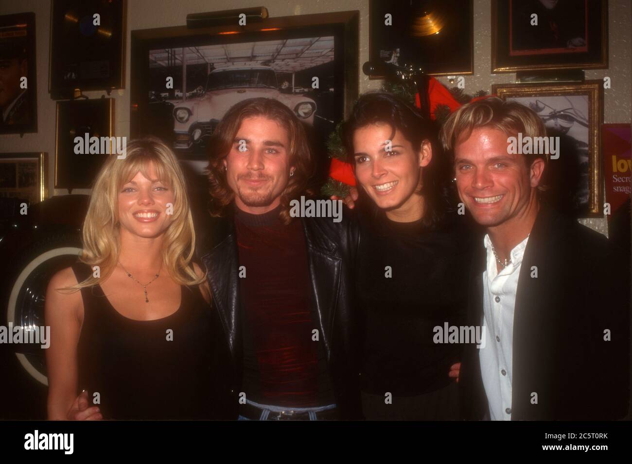 Los Angeles, California, USA 4th December 1995 (L-R) Actress Donna D'Errico, actor Jaason Simmons, actress Angie Harmon and actor David Chokachi attend event at Hard Rock Cafe on December 4, 1995 in Los Angeles, California, USA. Photo by Barry King/Alamy Stock Photo Stock Photo