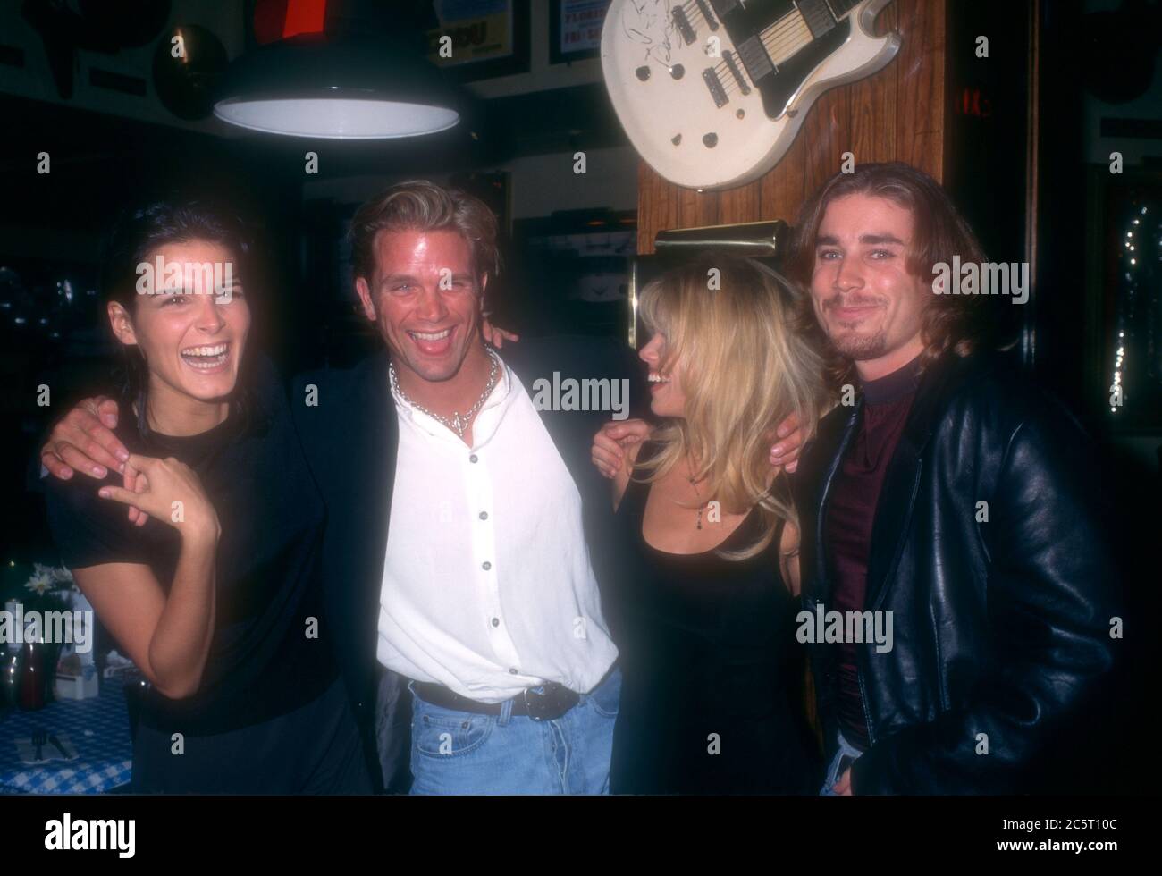 Los Angeles, California, USA 4th December 1995 (L-R) Actress Angie Harmon, actor David Chokachi, actress Donna D'Errico and actor Jaason Simmons attend event at Hard Rock Cafe on December 4, 1995 in Los Angeles, California, USA. Photo by Barry King/Alamy Stock Photo Stock Photo