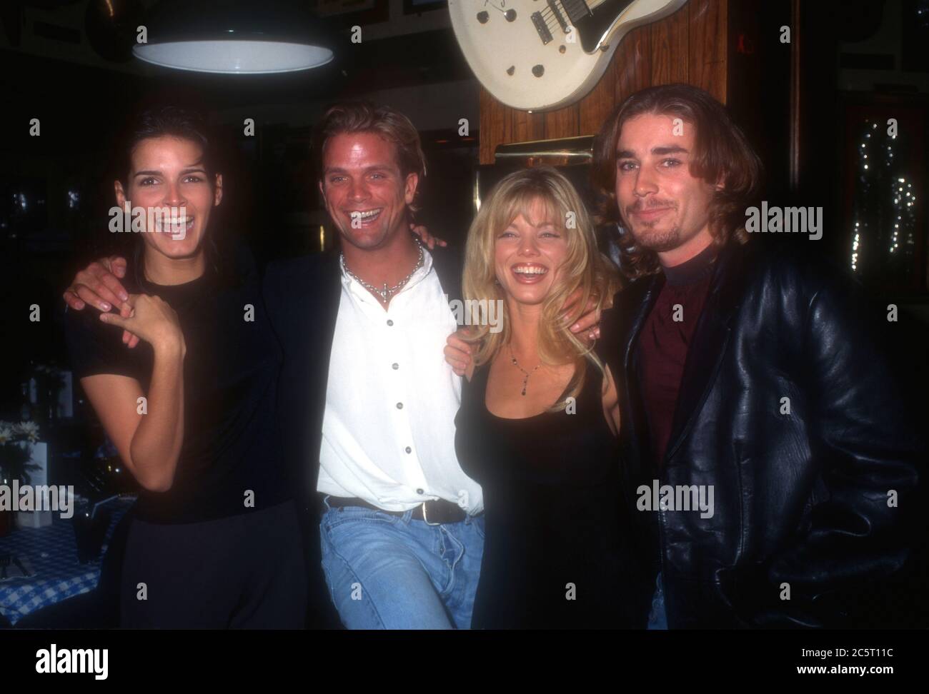 Los Angeles, California, USA 4th December 1995 (L-R) Actress Angie Harmon, actor David Chokachi, actress Donna D'Errico and actor Jaason Simmons attend event at Hard Rock Cafe on December 4, 1995 in Los Angeles, California, USA. Photo by Barry King/Alamy Stock Photo Stock Photo