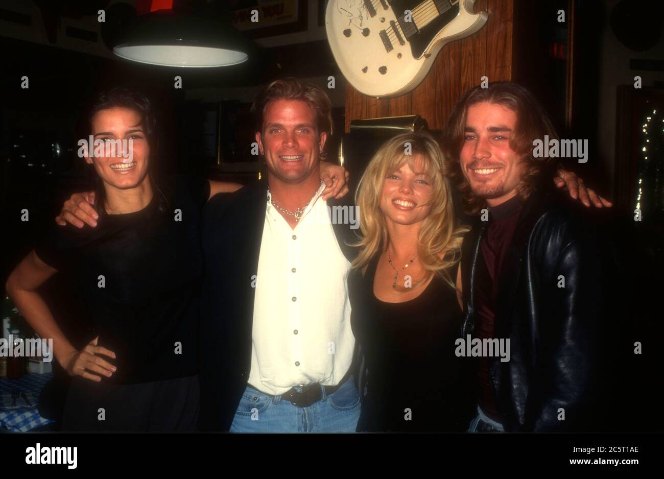 Los Angeles, California, USA 4th December 1995 (L-R) Actress Angie Harmon, actor David Chokachi, actress Donna D'Errico and actor Jaason Simmons attend event at Hard Rock Cafe on December 4, 1995 in Los Angeles, California, USA. Photo by Barry King/Alamy Stock Photo Stock Photo