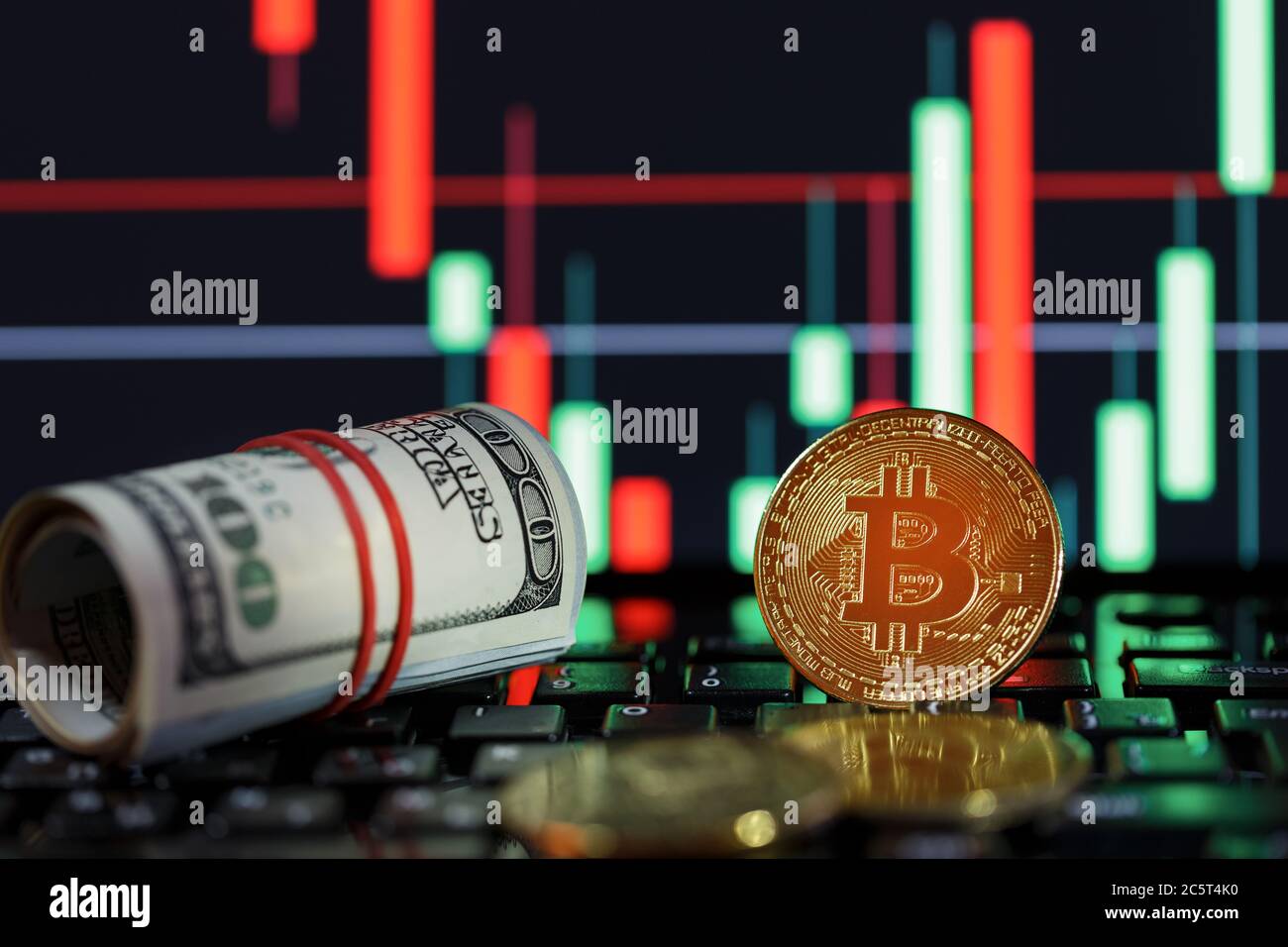 Bitcoin cryptocurrencies with dollars and a Graphic Display of a computer  monitor on the background Stock Photo - Alamy