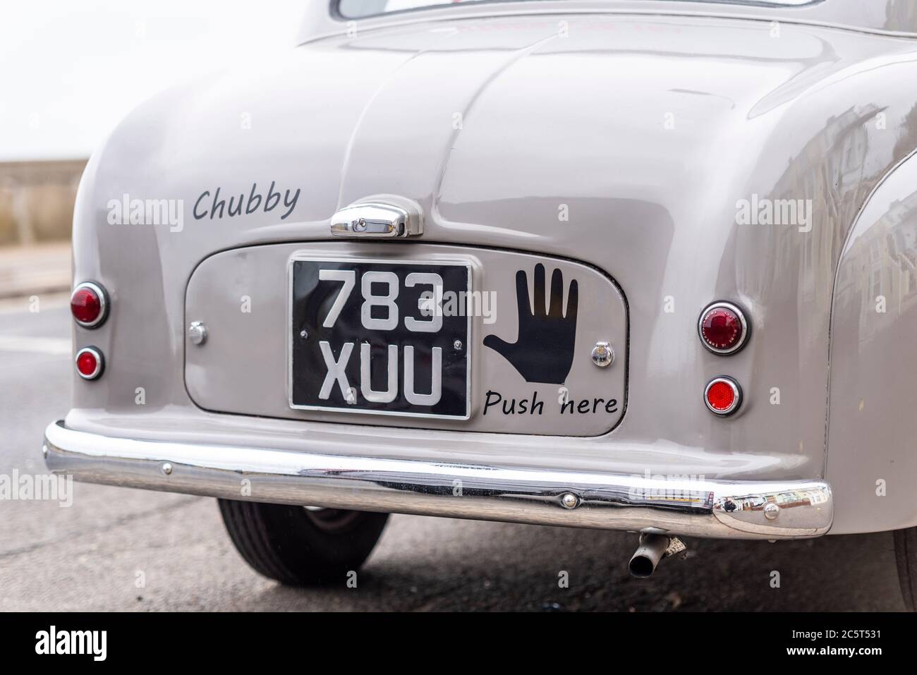Rear of vintage car with push here graphic in Southend on Sea, Essex, UK. Named Chubby. 1954 Standard Motors Company SMC Standard Eight Stock Photo