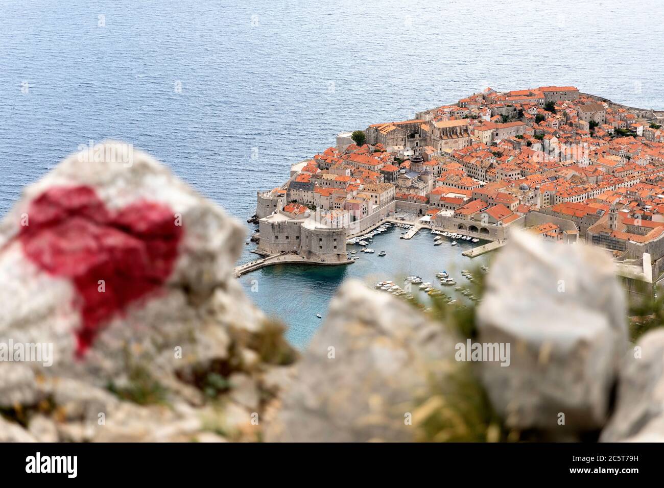 Heart drawing on the rock and panoramic aerial view of the historic town of Dubrovnik, from Srd mountain Stock Photo