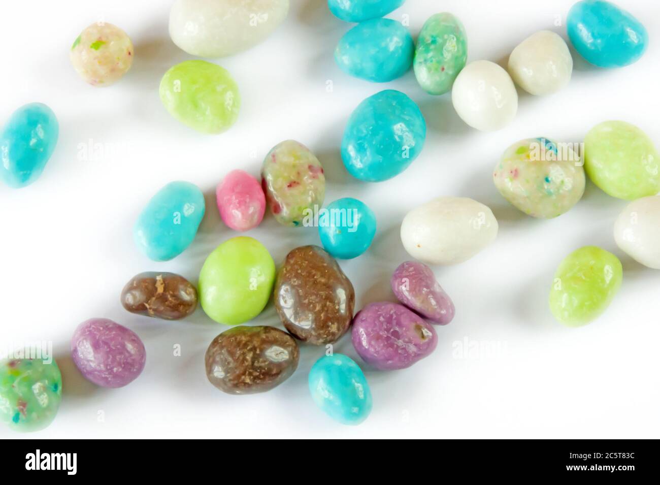 Group of colored sweet candies over white background Stock Photo - Alamy