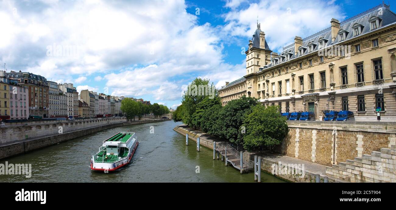 River seine with water bus and famous quay des Orfe`vres in Paris where ...