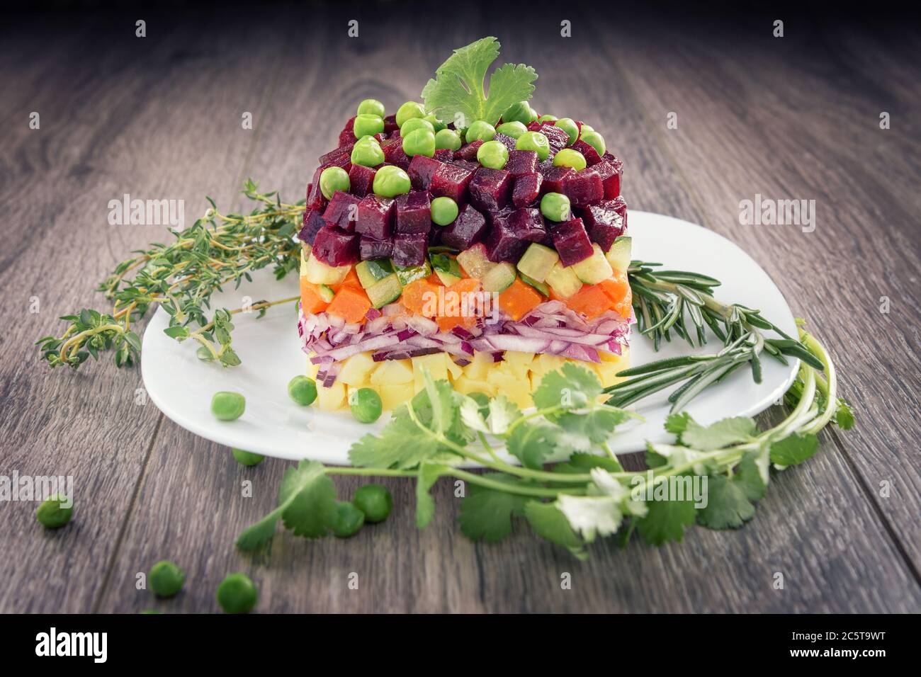 Traditional vegetarian Russian salad snack vinaigrette in a rustic recipe- Beet Salad.Vegan cuisine. Stock Photo