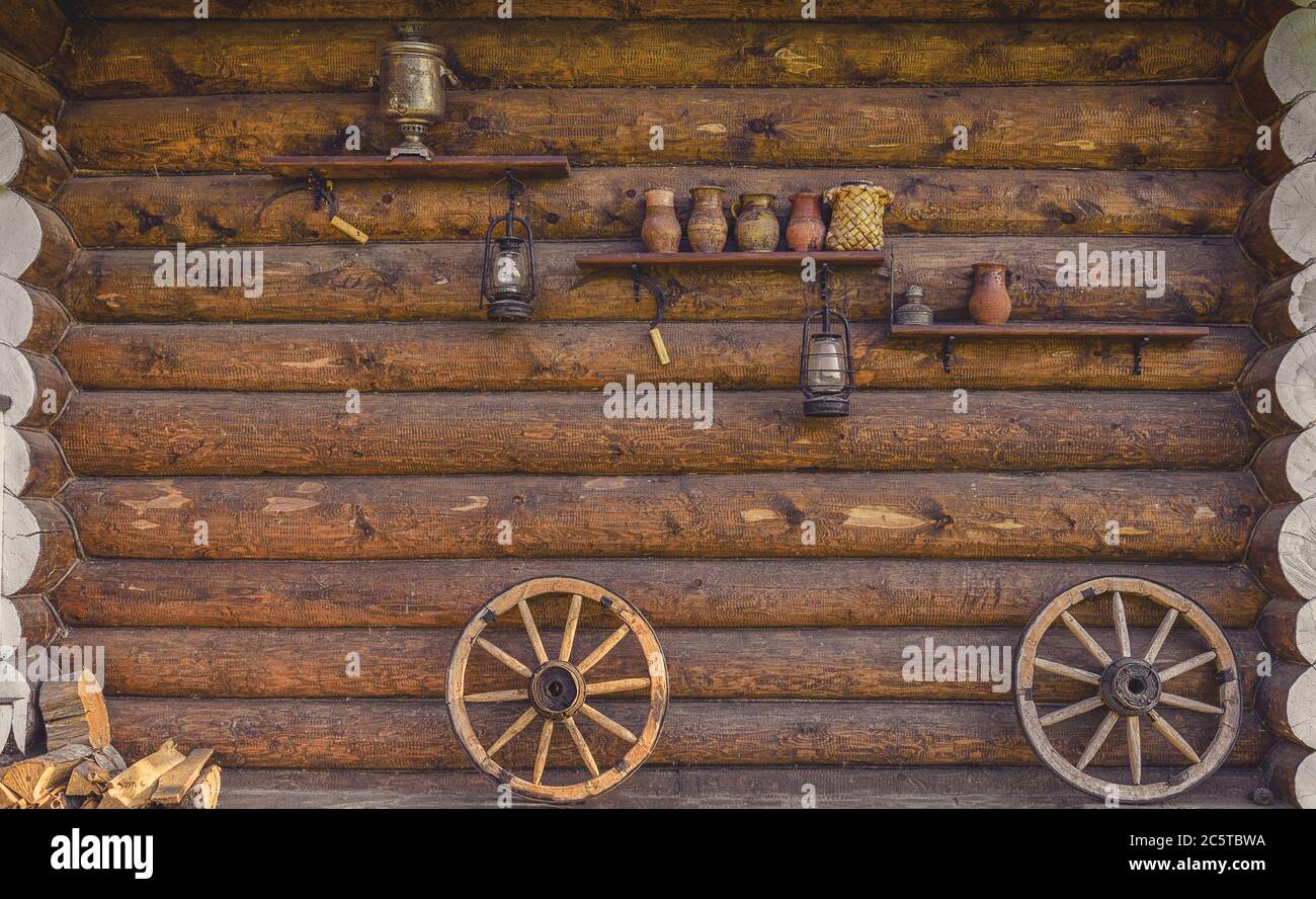 Ancient Russian household items on a wooden wall. Stock Photo