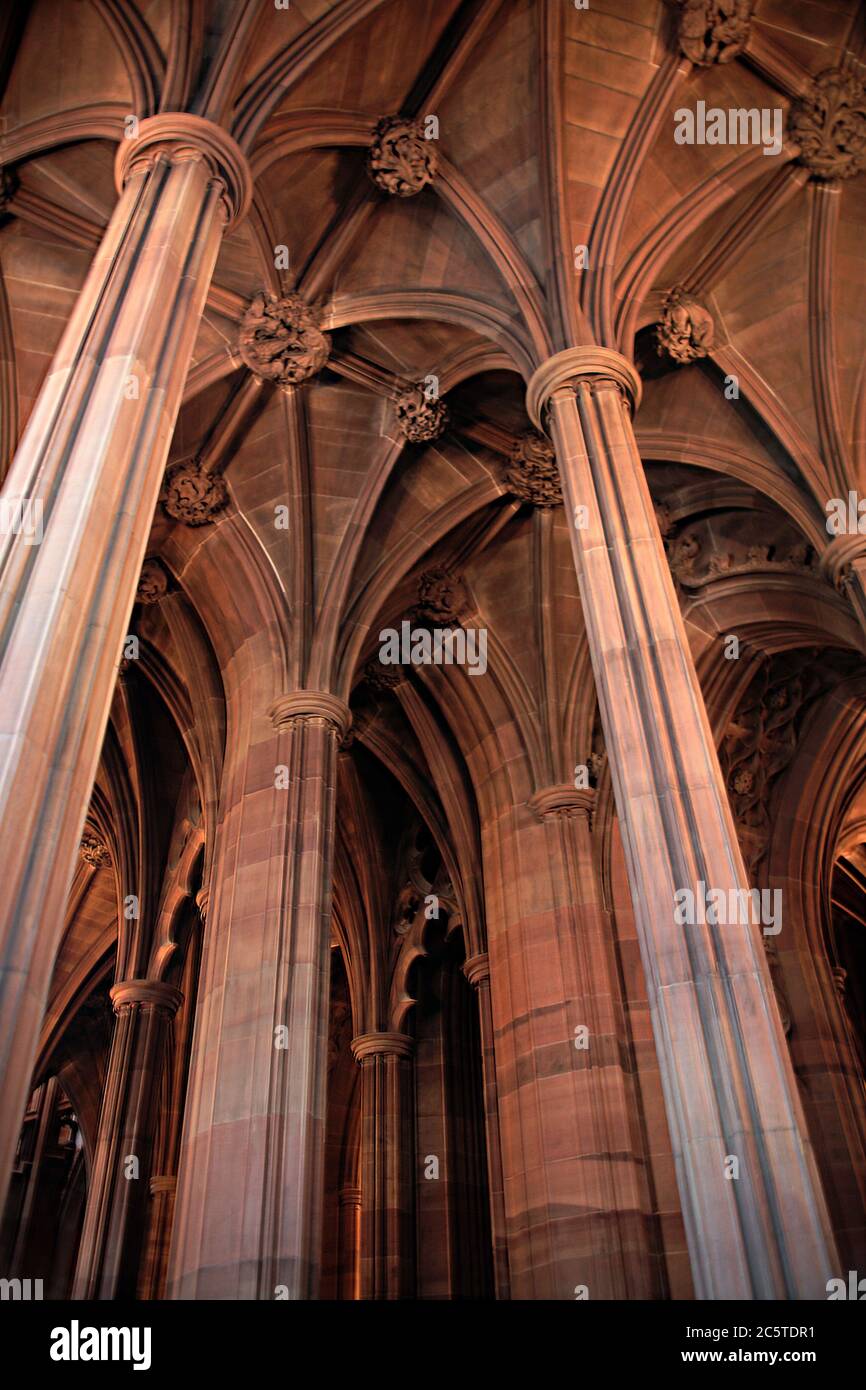 A forest of columns in the entrance hall of the Victorian gothic John Rylands Library, Deansgate, central Manchester, England, UK Stock Photo