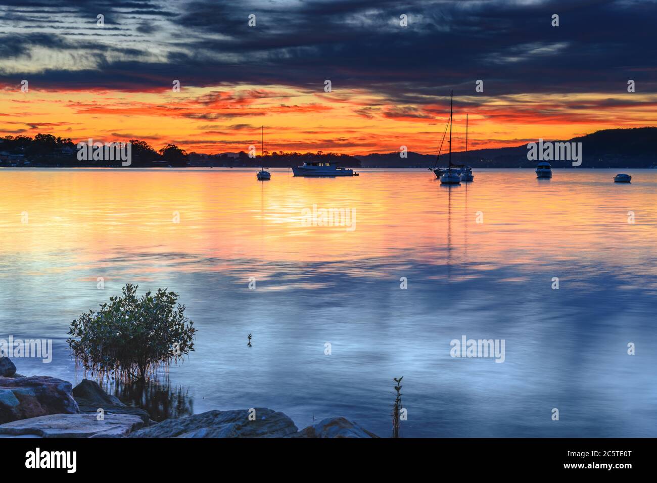 Colourful Clouds and Sunrise from Koolewong Waterfront on the Central Coast, NSW, Australia. Stock Photo