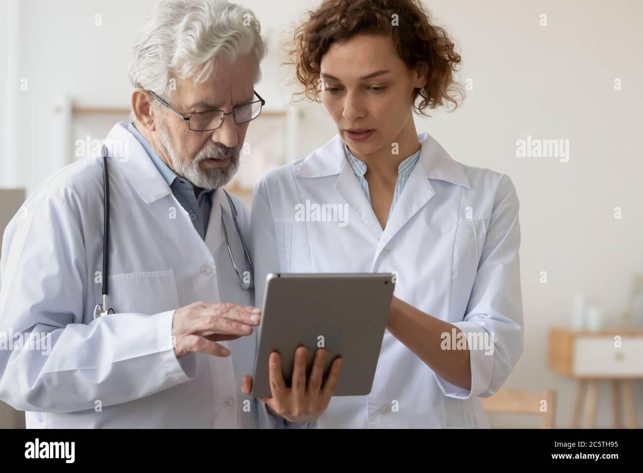 Diverse male female doctors using hi-res stock photography and images ...