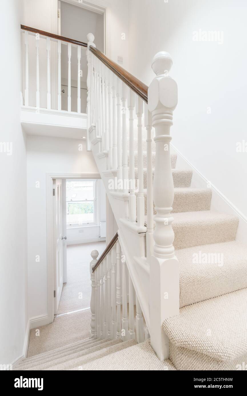Bright hallway with wooden stairs Stock Photo Alamy