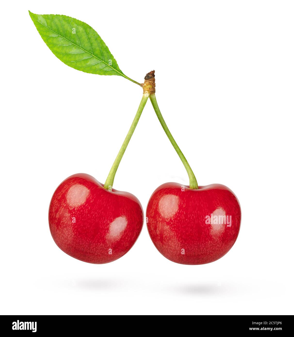 Two cherries with leaf isolated on white background. Clipping path. Stock Photo