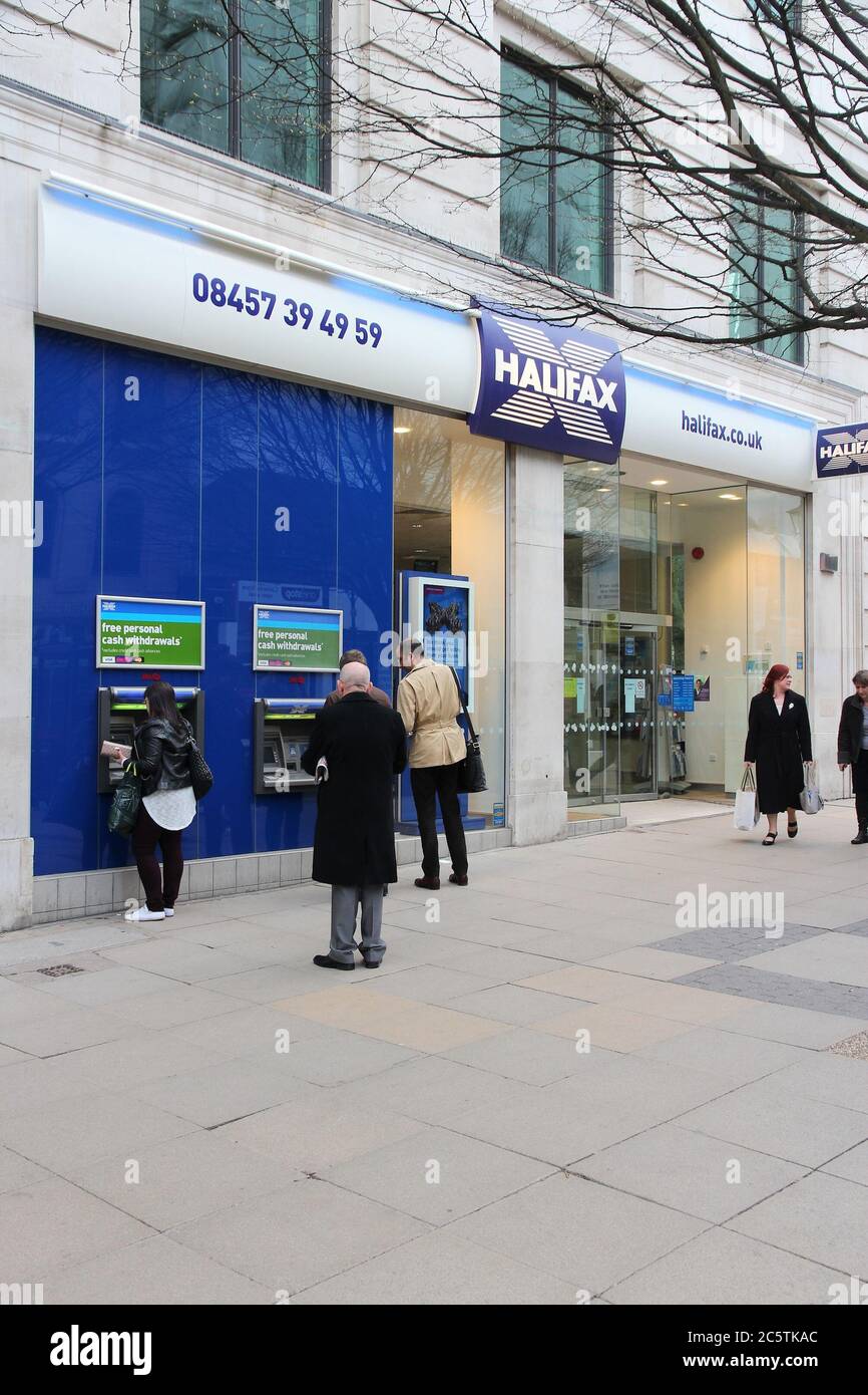 BIRMINGHAM, UK - APRIL 19, 2013: People visit Halifax Bank in Birmingham, UK. Halifax is part of Lloyds Banking Group, one of largest banking corporat Stock Photo