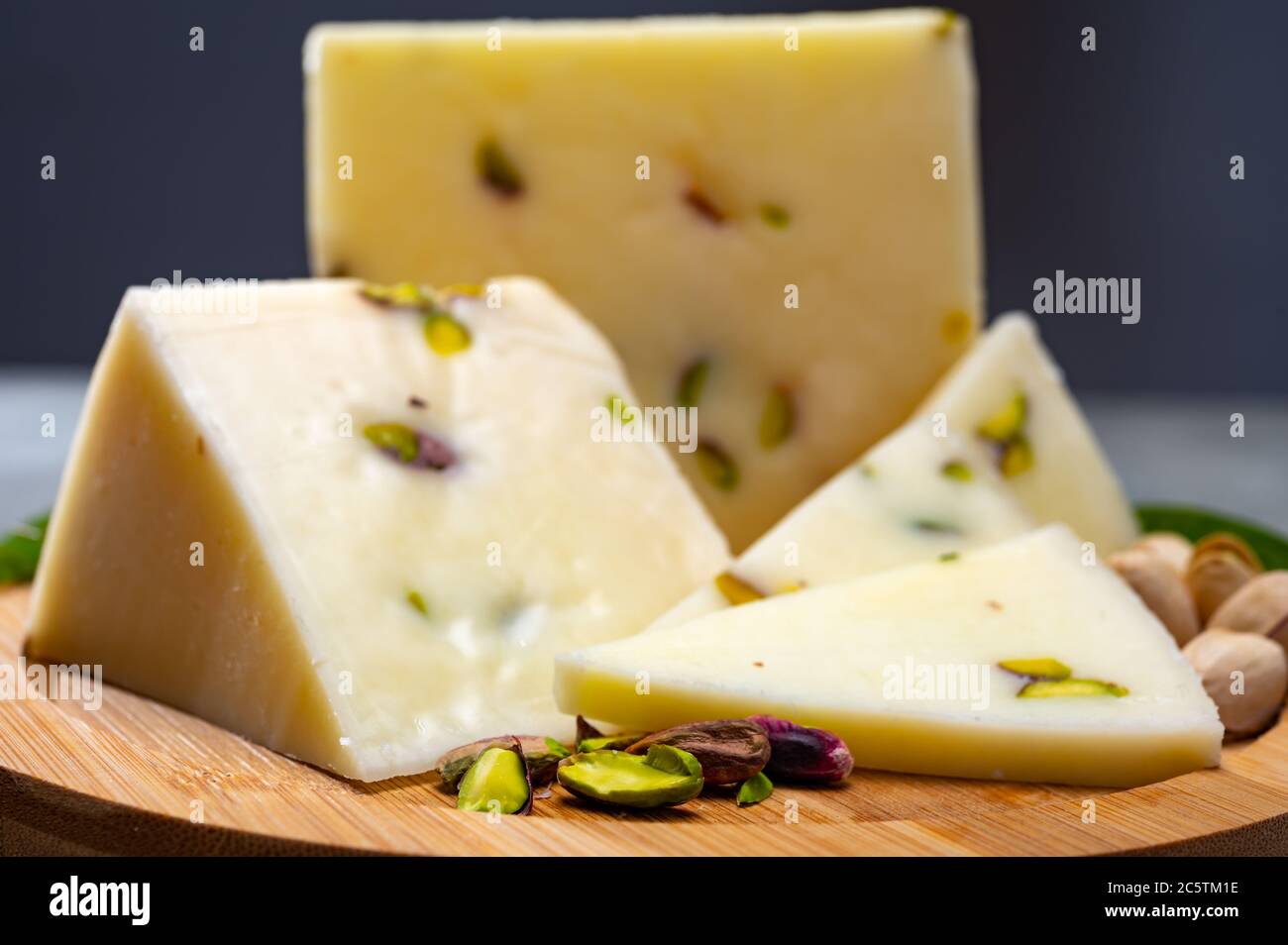 Cheese collection, fresh Italian pecorino cheese made from sheep milk filled with pistachio nuts