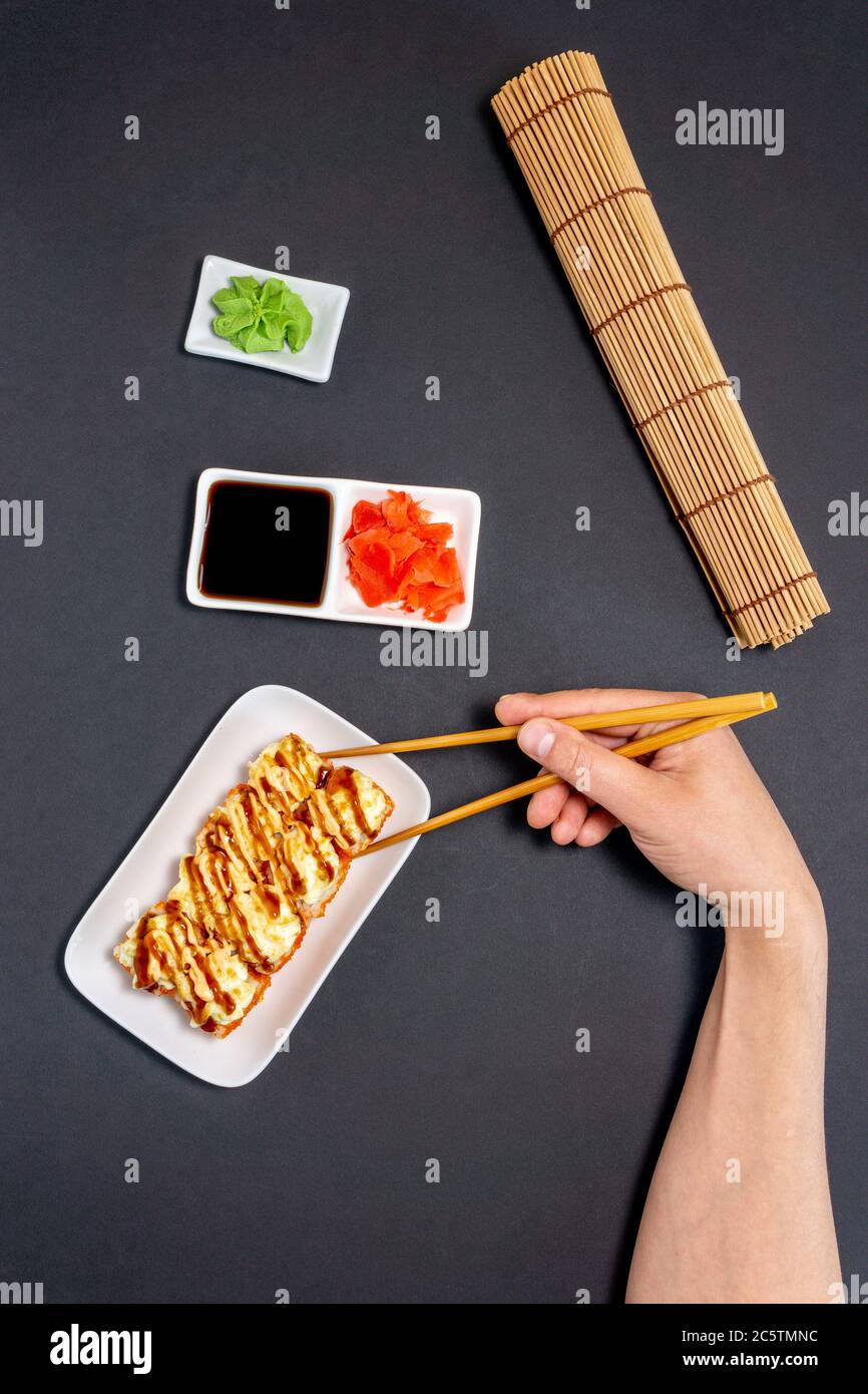 Sushi rolly, maki, nigiri Set on black stone on dark background. top view flat lay Stock Photo