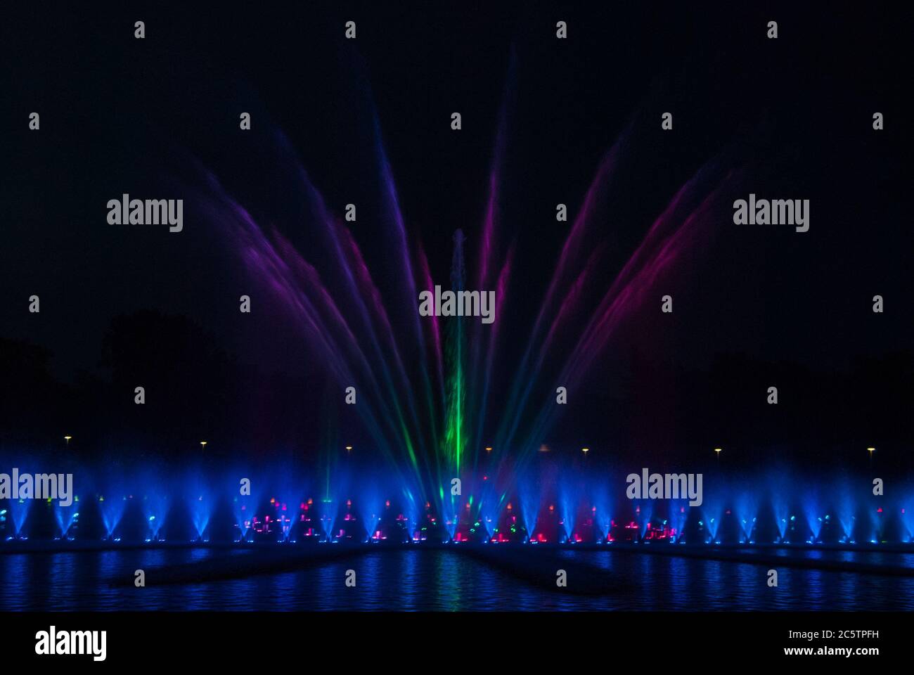 Fountain at night illuminated by lights Stock Photo - Alamy