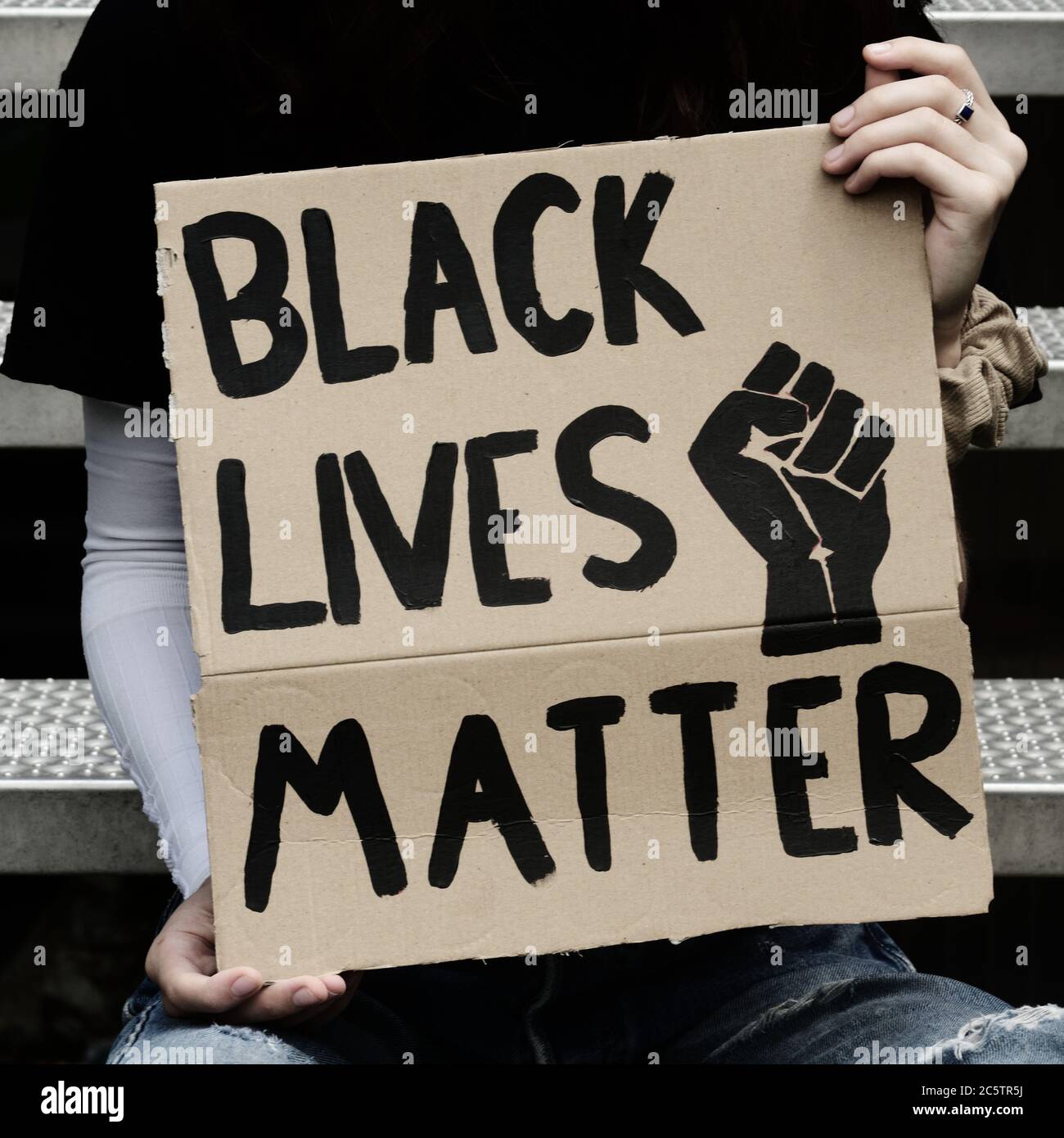 Girl holding a sign 'Black Lives Matter) Stock Photo