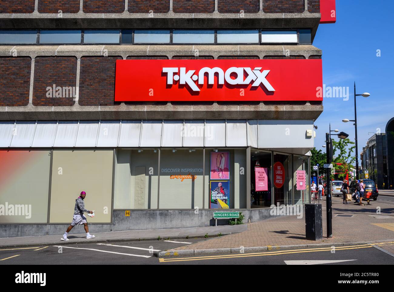Bromley (Greater London), Kent, UK. TK Maxx store in Bromley High Street and Ringers Road showing the TK Maxx logo. View of the road and a pedestrian. Stock Photo