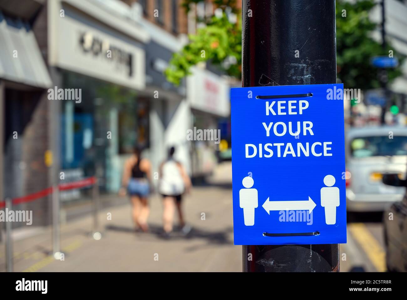 Bromley (Greater London), Kent, UK. Keep your distance sign on Bromley High Street during the coronavirus pandemic. Sign in focus, background blurred. Stock Photo
