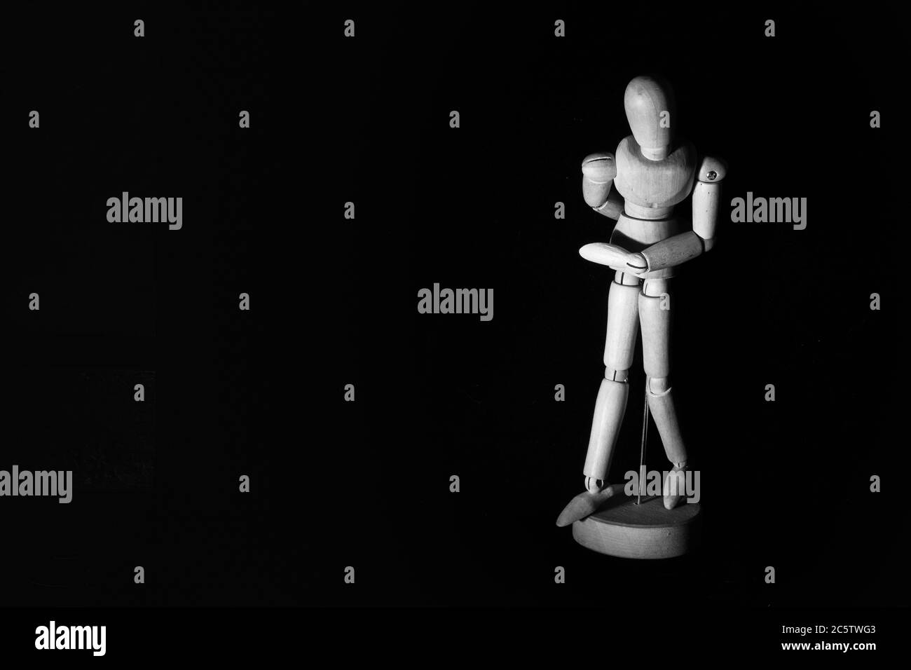 Wooden Human Manikin posing on a black background Stock Photo Alamy