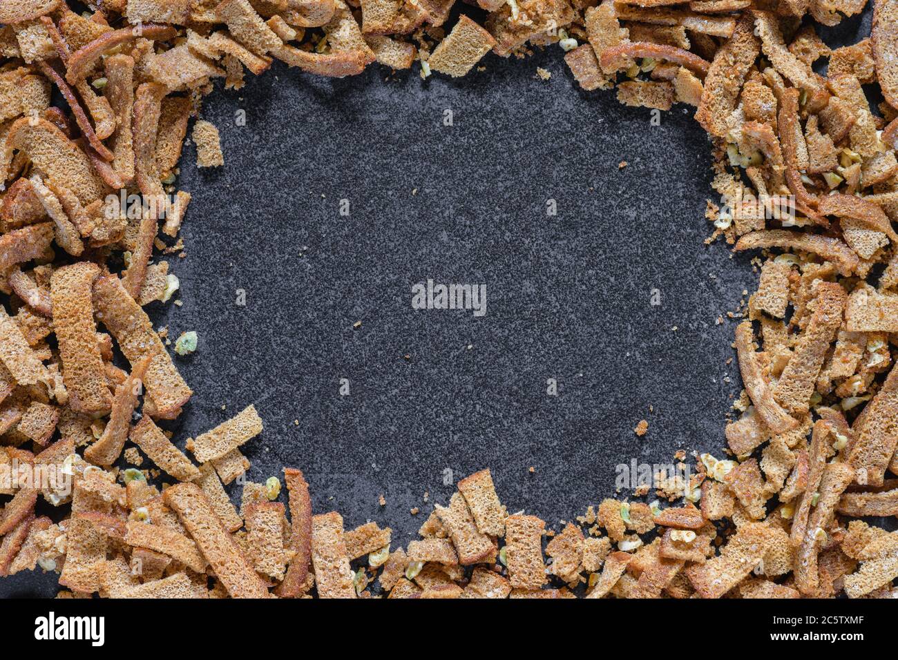 Salty, bread crumbs with garlic for beer and a frame for copy space. Stock Photo