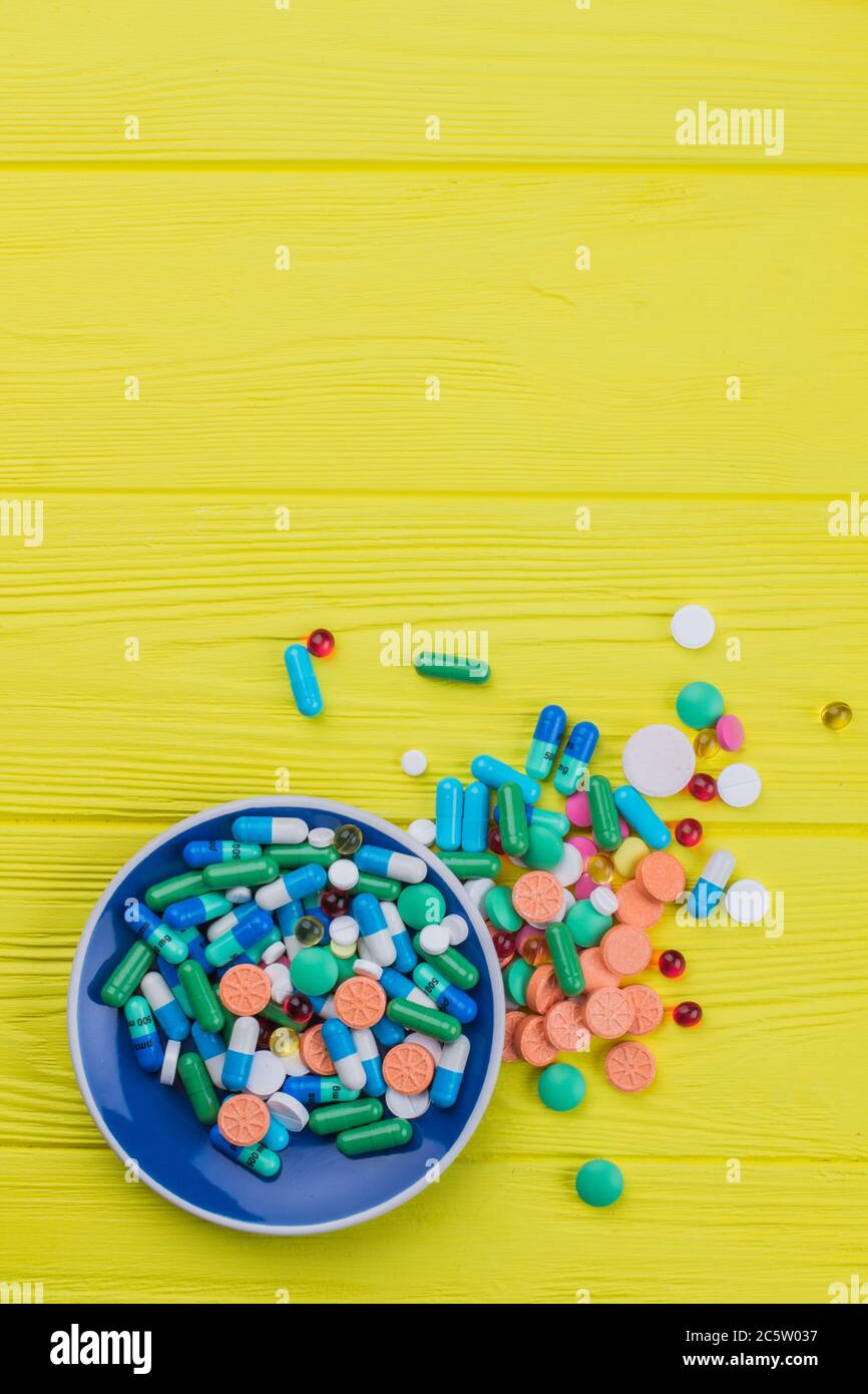 Heap of colored drugs on a tea plate Stock Photo Alamy