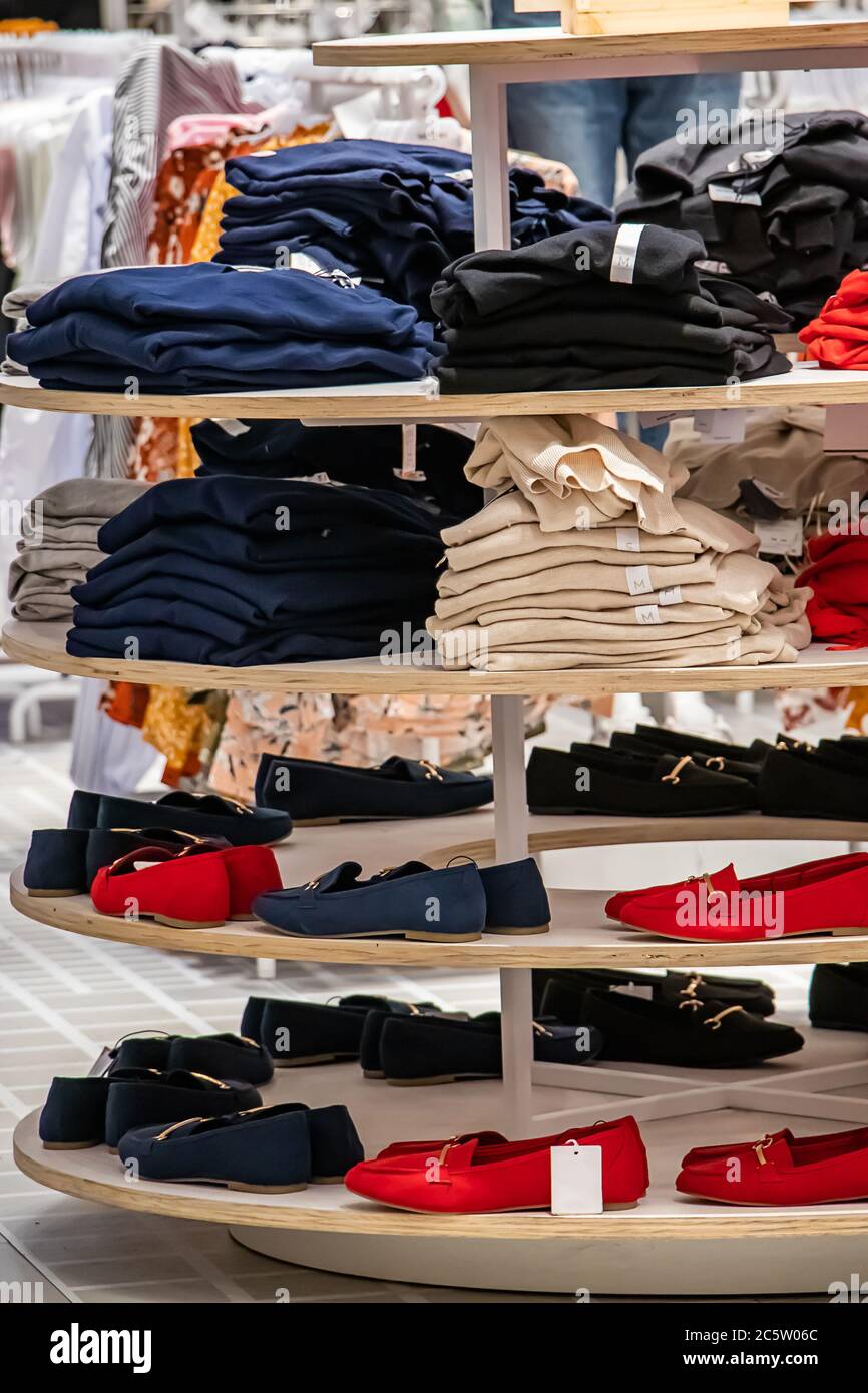 Sale of fashionable clothes in a shopping center. Stock Photo