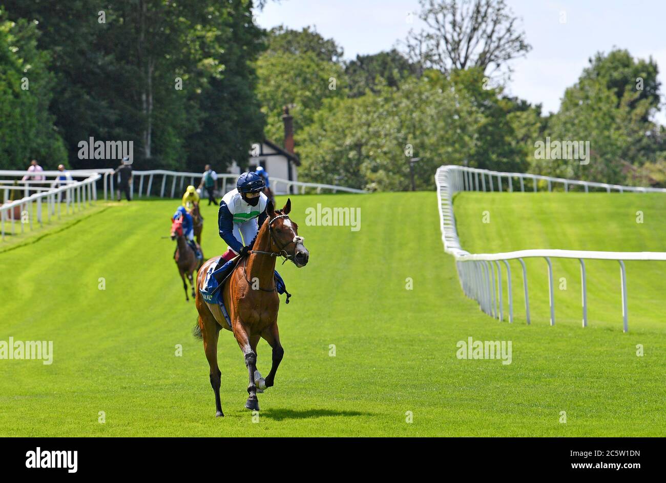 Dashing Willoughby and jockey Oisin Murphy wins the Coral Henry II Stakes at Sandown Park Racecourse. Stock Photo