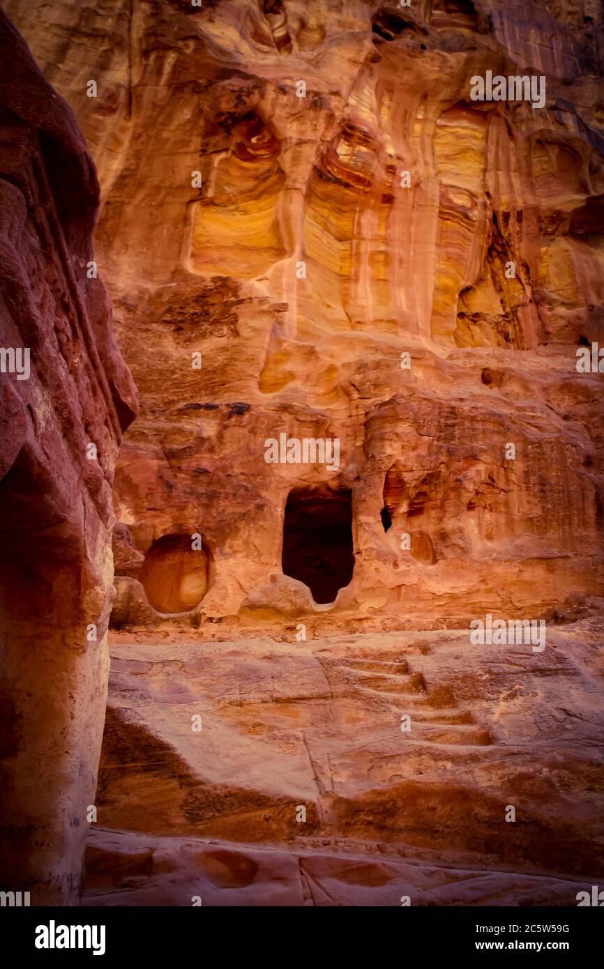 Nabatean cave in the Wadi Musa leading to ancient Petra, Jordan, one of the New Seven Wonders of the World and a UNESCO world heritage site. Stock Photo