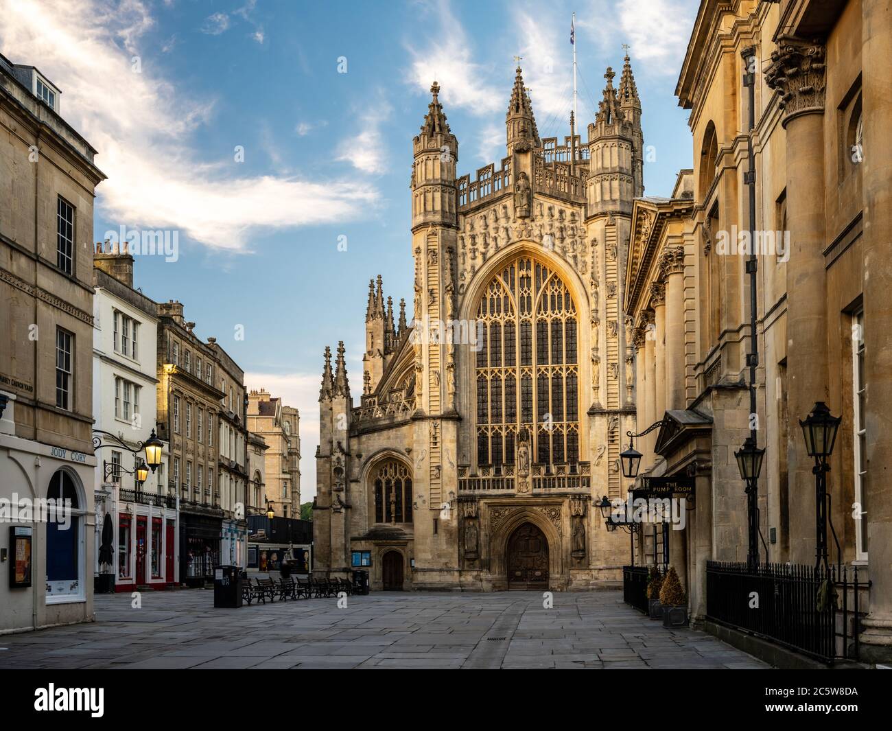 Evening light falls on the west front of the gothic Abbey Church, and Georgian buildings of the Abbey Church Yard square, including the Roman Baths, i Stock Photo