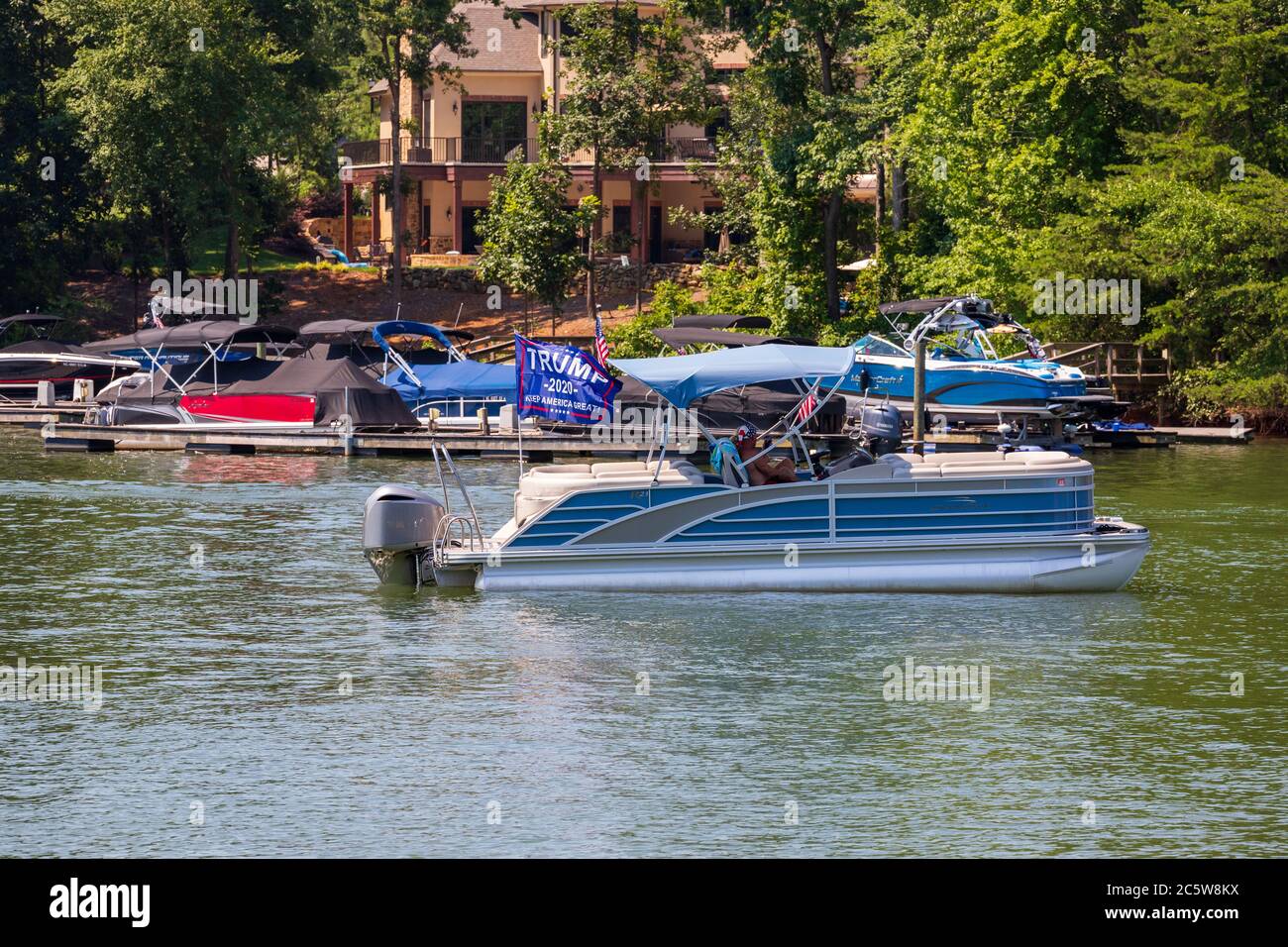 Mooresville, NC, USA - July 4, 2020: Boat flying Trump 2020 flag for President Donald Trump on Lake Norman near the Trump National Golf Club Charlotte Stock Photo