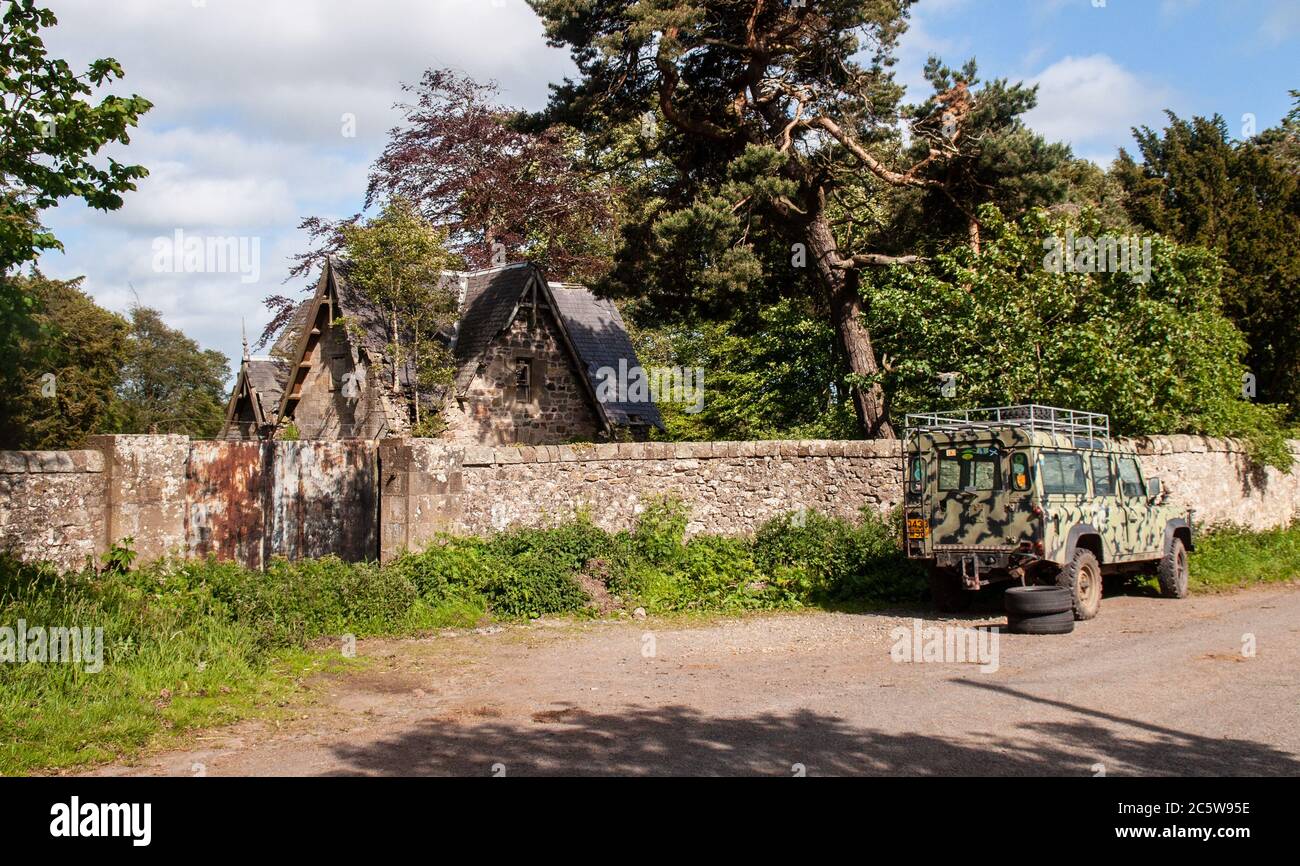 Trees grow through the ruined roof of a gatehouse at Middleton Hall in Midlothian, Scotland. Stock Photo