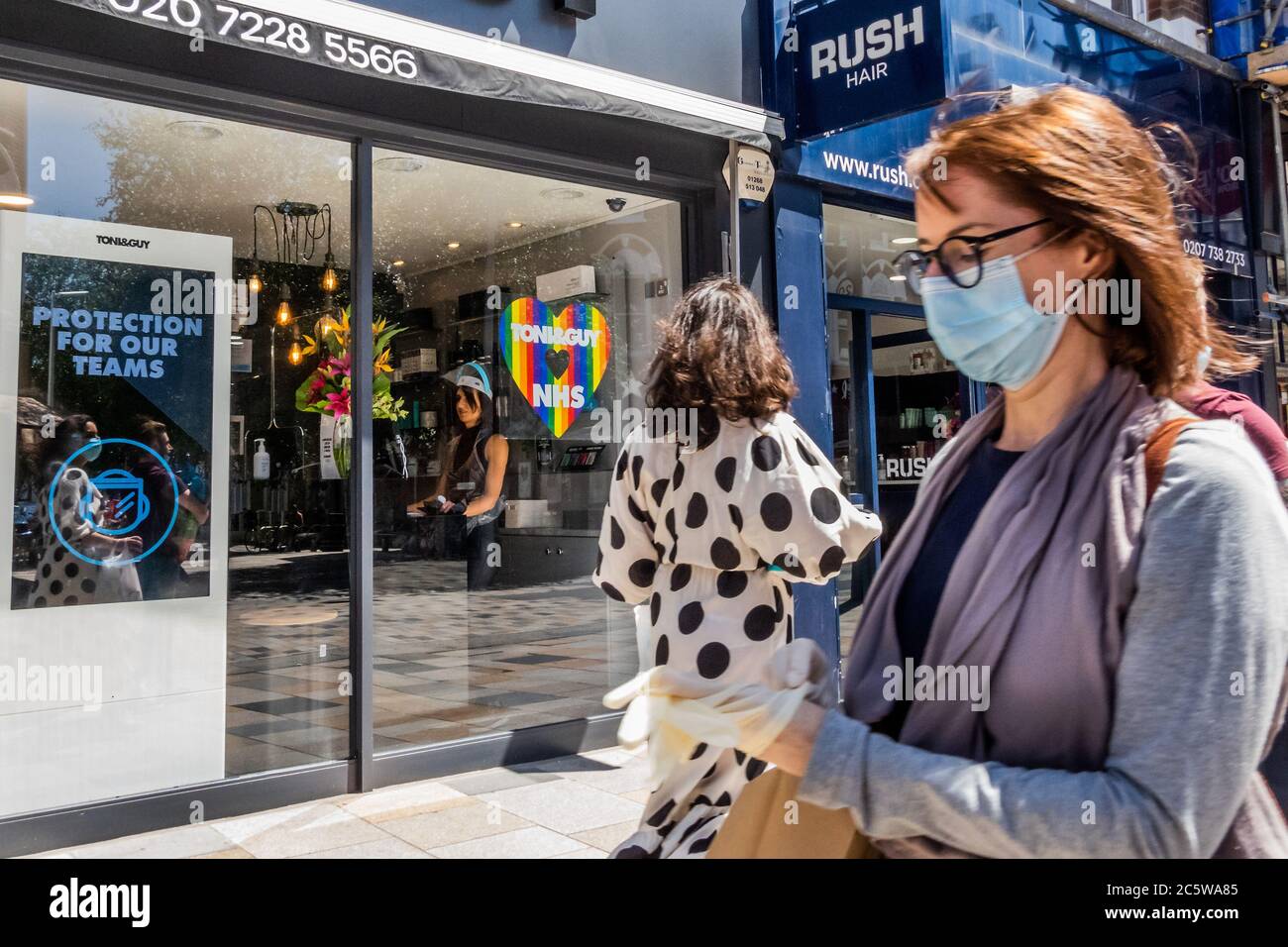 London, UK. 05th July, 2020. Hair salons re-open with Toni and Guy showing the rainbow of support for the NHS - Wider reopening of bars and restaurants in Battersea as the next stage of the easing of the Coronavirus (covid 19) Lockdown arrives. Credit: Guy Bell/Alamy Live News Stock Photo