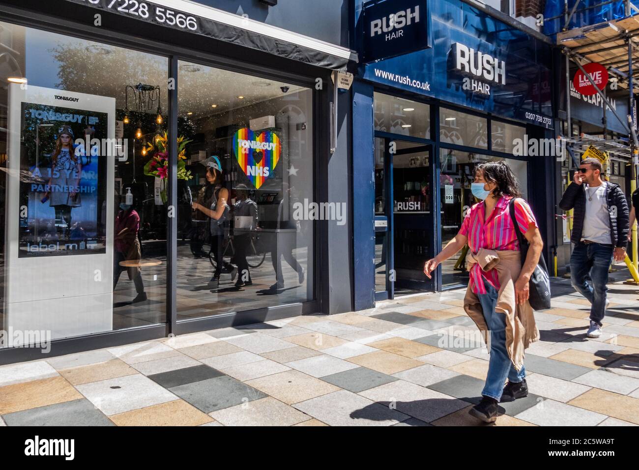 London, UK. 05th July, 2020. Hair salons re-open with Toni and Guy showing the rainbow of support for the NHS - Wider reopening of bars and restaurants in Battersea as the next stage of the easing of the Coronavirus (covid 19) Lockdown arrives. Credit: Guy Bell/Alamy Live News Stock Photo