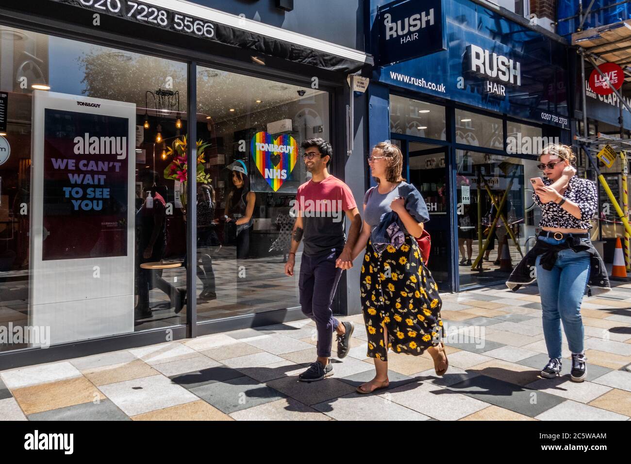 London, UK. 05th July, 2020. Hair salons re-open with Toni and Guy showing the rainbow of support for the NHS - Wider reopening of bars and restaurants in Battersea as the next stage of the easing of the Coronavirus (covid 19) Lockdown arrives. Credit: Guy Bell/Alamy Live News Stock Photo