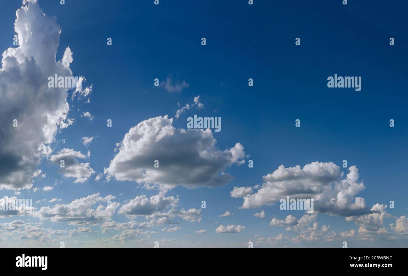 Fluffy clouds in the blue sky sunny day cumulus scape white beautiful ...
