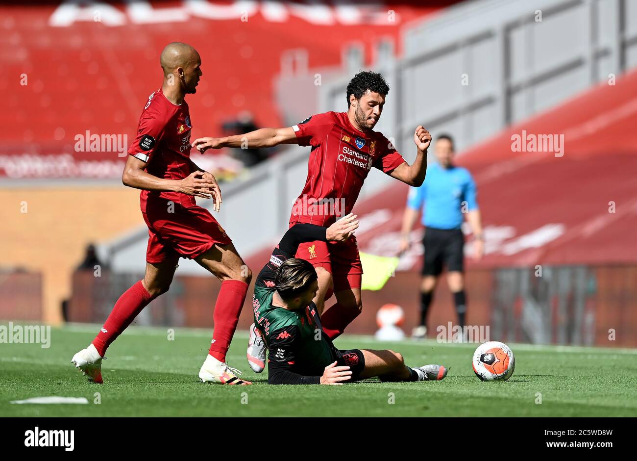 Liverpool's Fabinho (left) and Alex Oxlade-Chamberlain challenge Aston