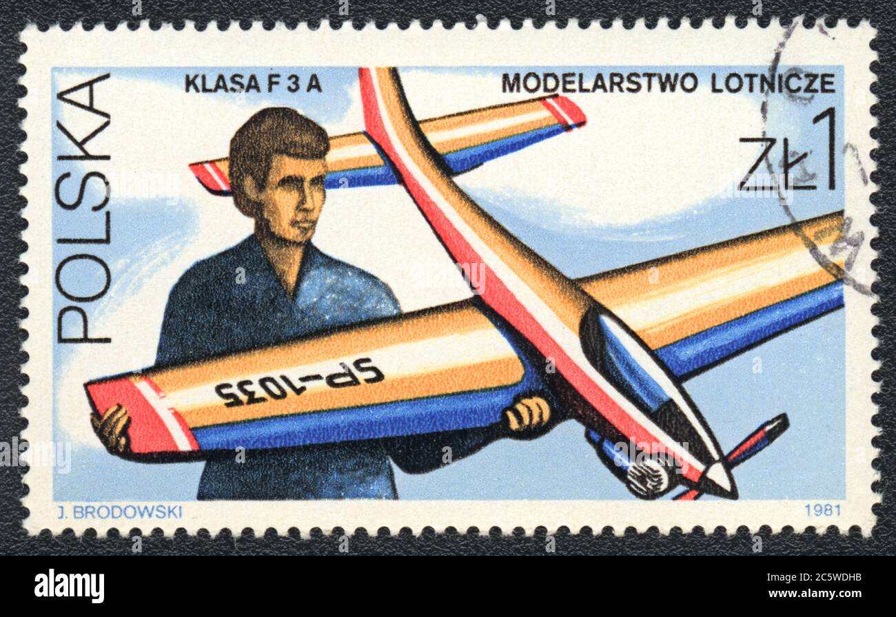 Postage stamp. The model radio controlled airplane class F 3 A in the hand of an aviator, Poland, 1981 Stock Photo