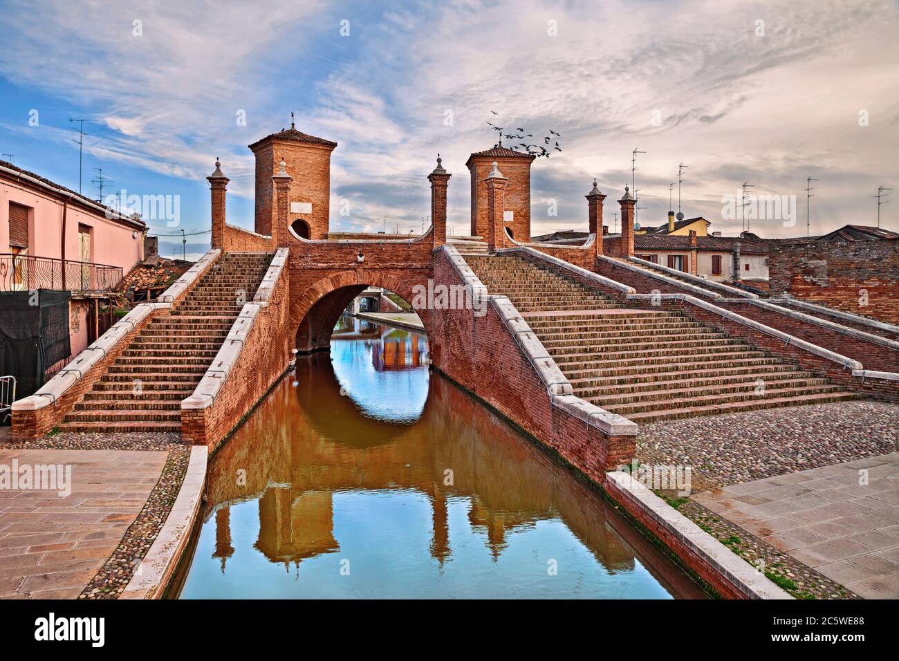 Comacchio, Ferrara, Emilia Romagna, Italy: the ancient bridge Trepponti, a famous five-way bridge in the old town known as the Little Venice Stock Photo