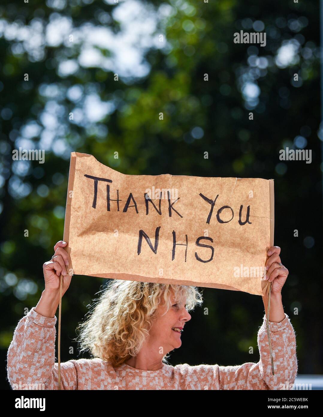 Brighton UK 5th July 2020 - Residents in the Queens Park area of Brighton join in the Clap For Carers at 5pm today to mark the 72nd anniversary of the NHS which was founded in 1948 : Credit Simon Dack / Alamy Live News Stock Photo