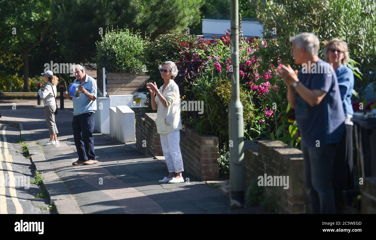 Brighton UK 5th July 2020 - Residents in the Queens Park area of Brighton join in the Clap For Carers at 5pm today to mark the 72nd anniversary of the NHS which was founded in 1948 : Credit Simon Dack / Alamy Live News Stock Photo
