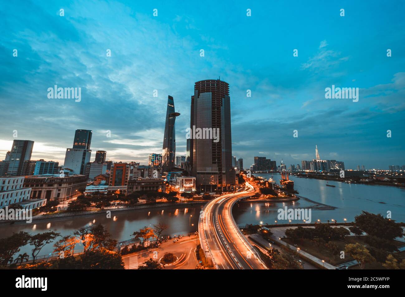 SAIGON, VIETNAM JULY 04, 2020 Ho Chi Minh city at night, Khanh Hoi bridge, yellow trail on