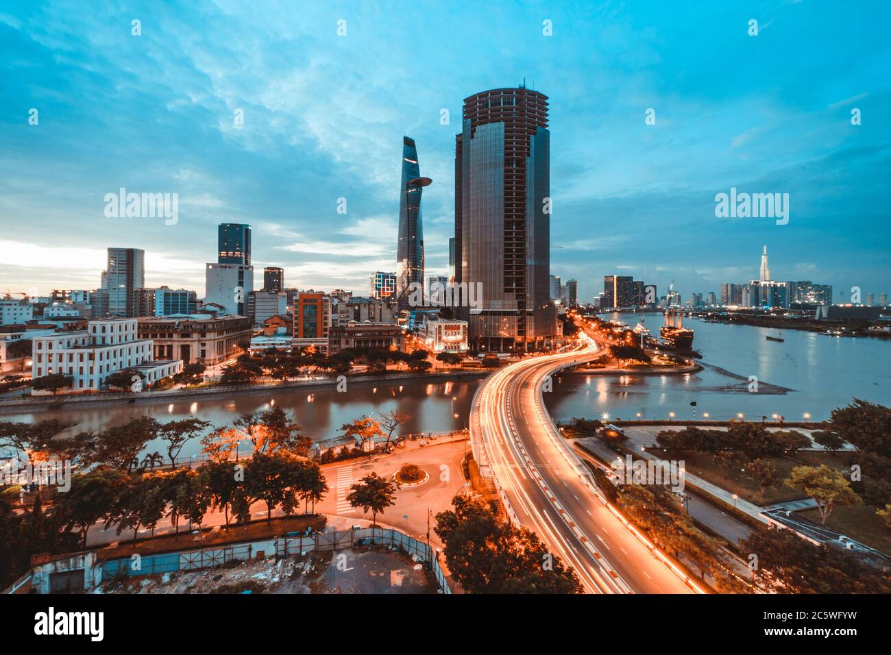 SAIGON, VIETNAM JULY 04, 2020 Ho Chi Minh city at night, Khanh Hoi bridge, yellow trail on