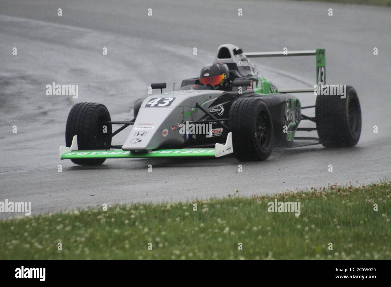 Open wheel racing in the rain at Mid-Ohio Sports Car Course Stock Photo ...