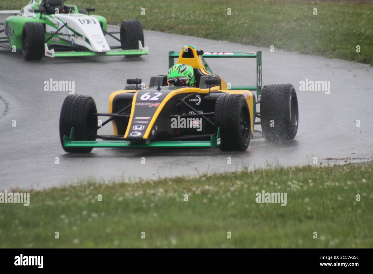Open wheel racing in the rain at Mid-Ohio Sports Car Course Stock Photo ...
