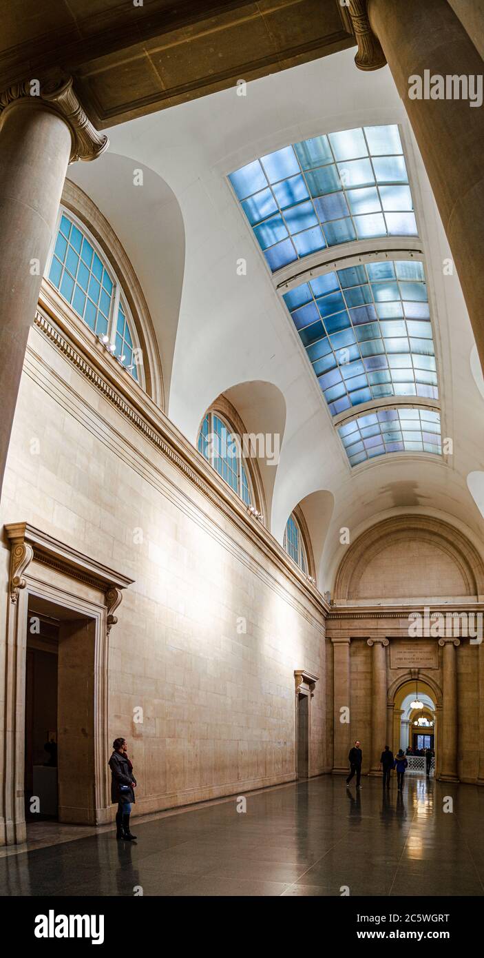 The very spacious interior of the Tate Britain Museum with visitors Stock Photo