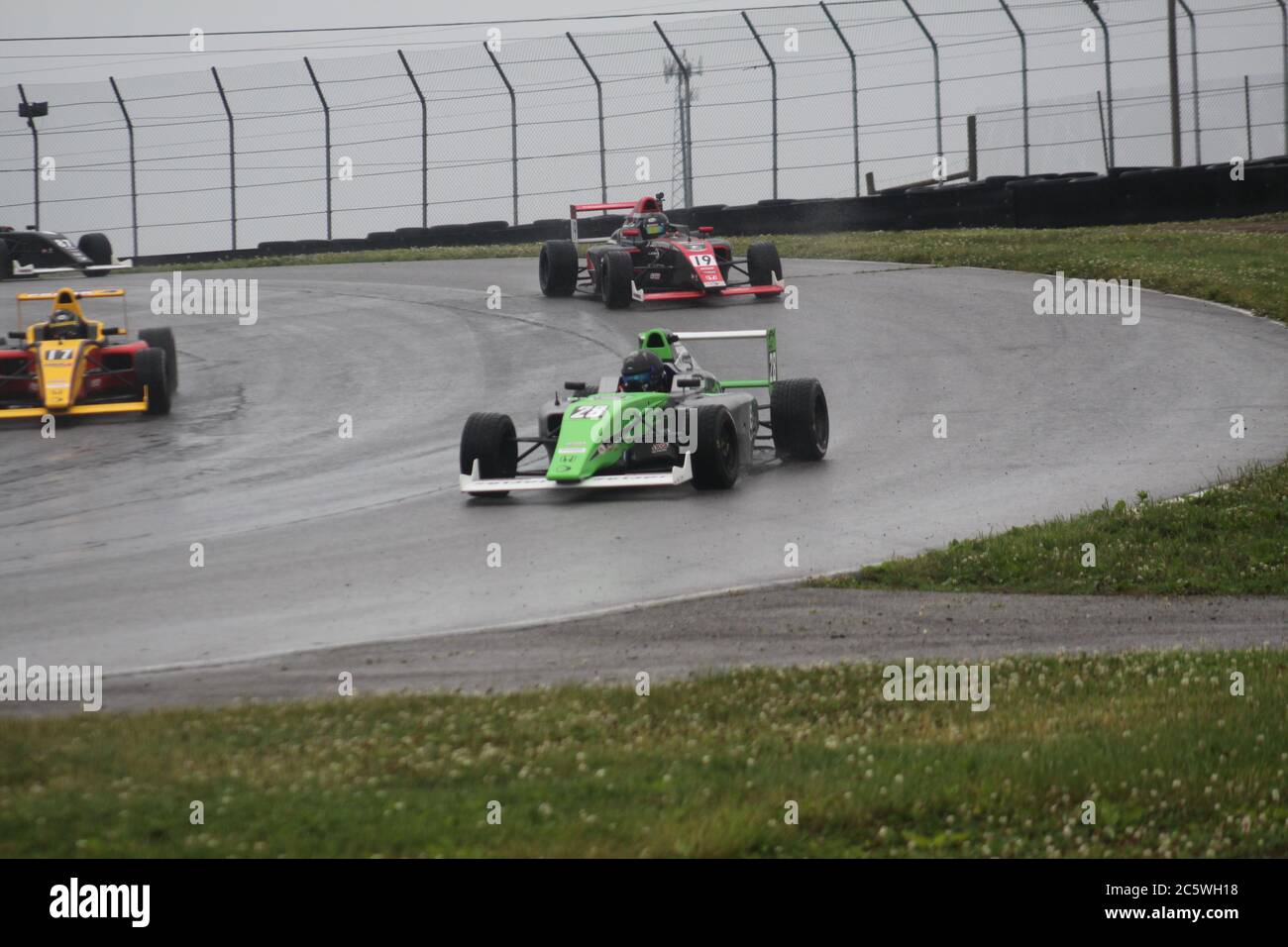 Open wheel racing in the rain at Mid-Ohio Sports Car Course Stock Photo ...