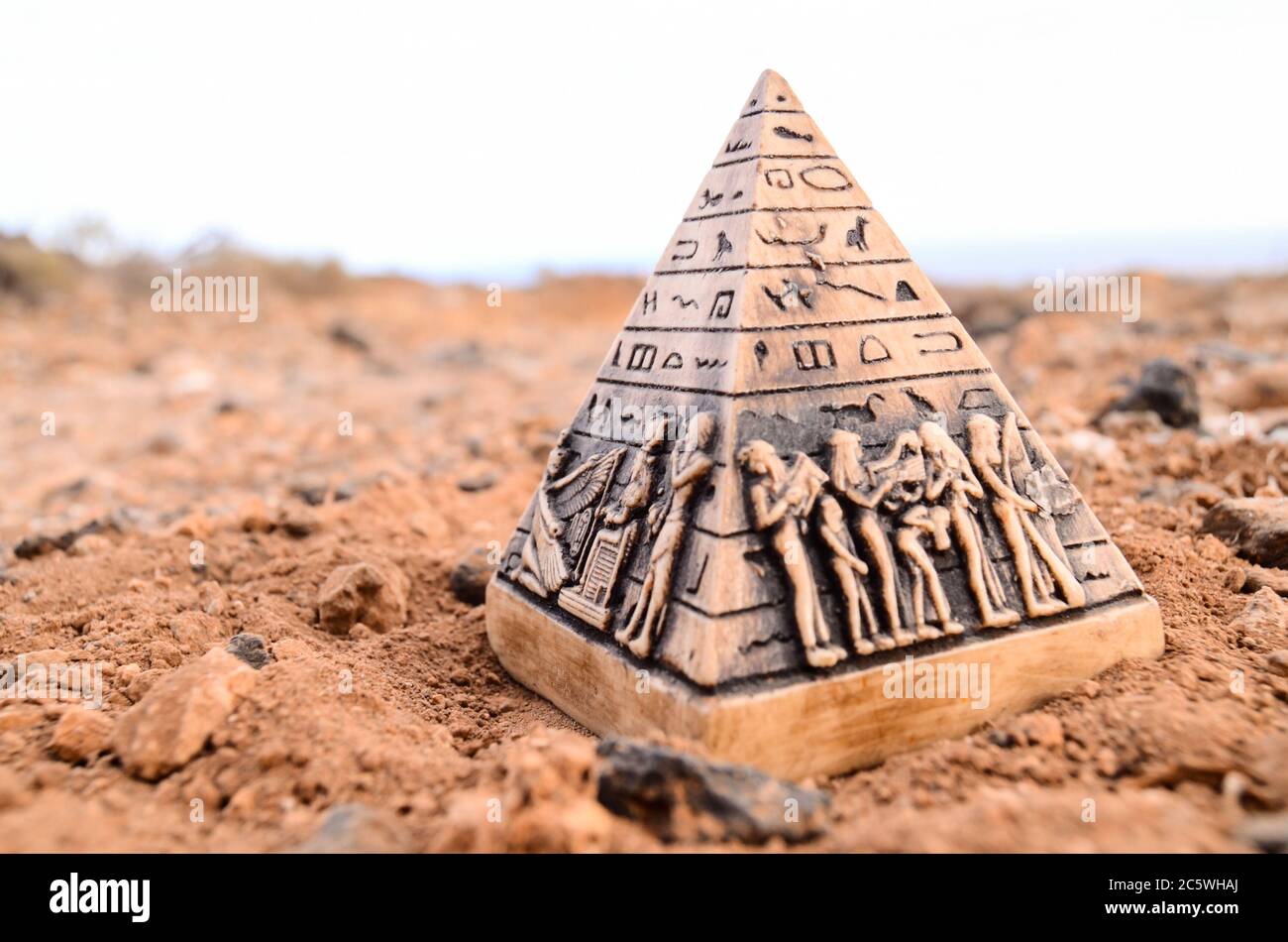 Egyptian Pyramid Model Miniature in the Rock Desert Stock Photo - Alamy