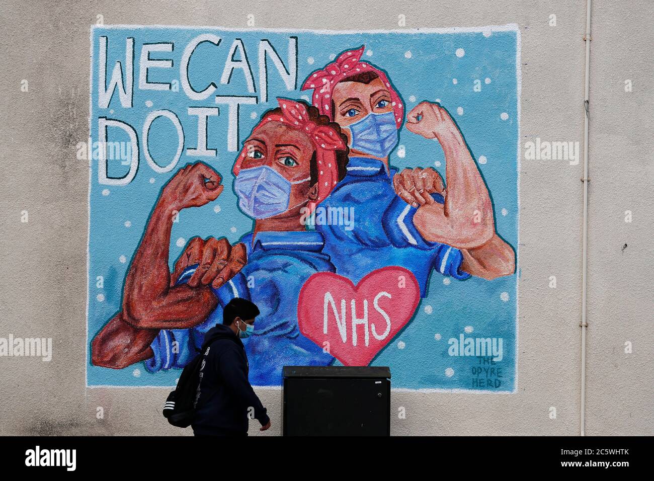 Loughborough, Leicestershire, UK. 5th July 2020. A man walks past a mural paying tribute to the National Health Service on its 72nd anniversary during the coronavirus pandemic. Credit Darren Staples/Alamy Live News. Stock Photo