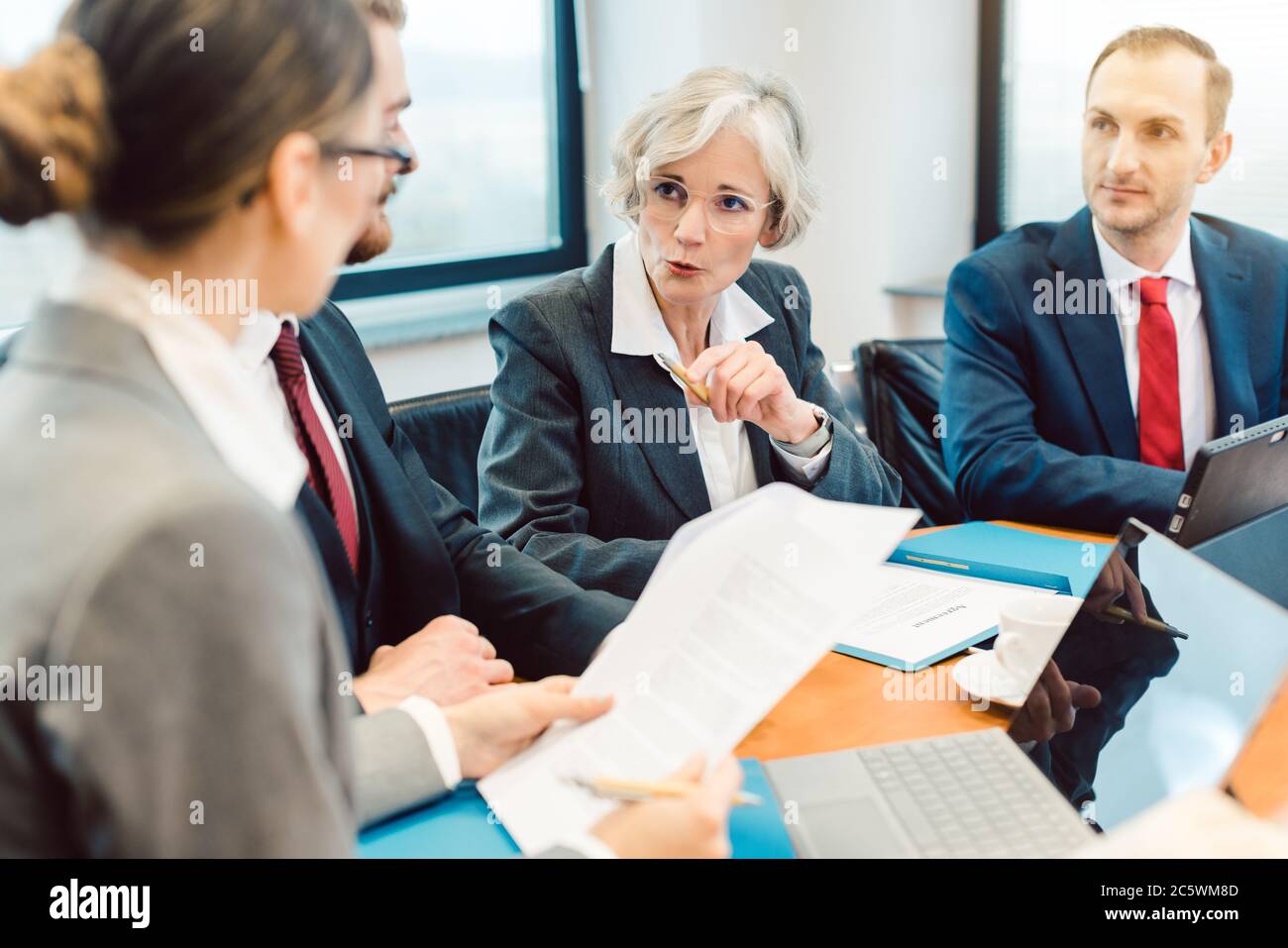 Experienced attorney with her team of professionals working Stock Photo